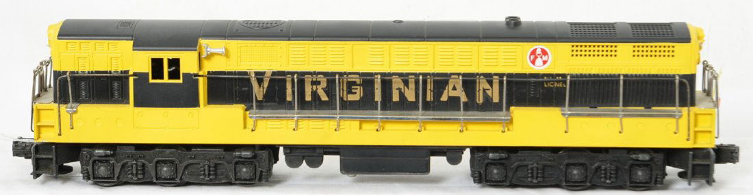 Lionel 2331 black and yellow Virginian FM Trainmaster: Postwar Lionel O gauge 2331 Virginian Fairbanks Morse Trainmaster diesel locomotive. Reproduction shell. Postwar chassis exterior appears original finish. Battery compartment is perfectly clean. Train