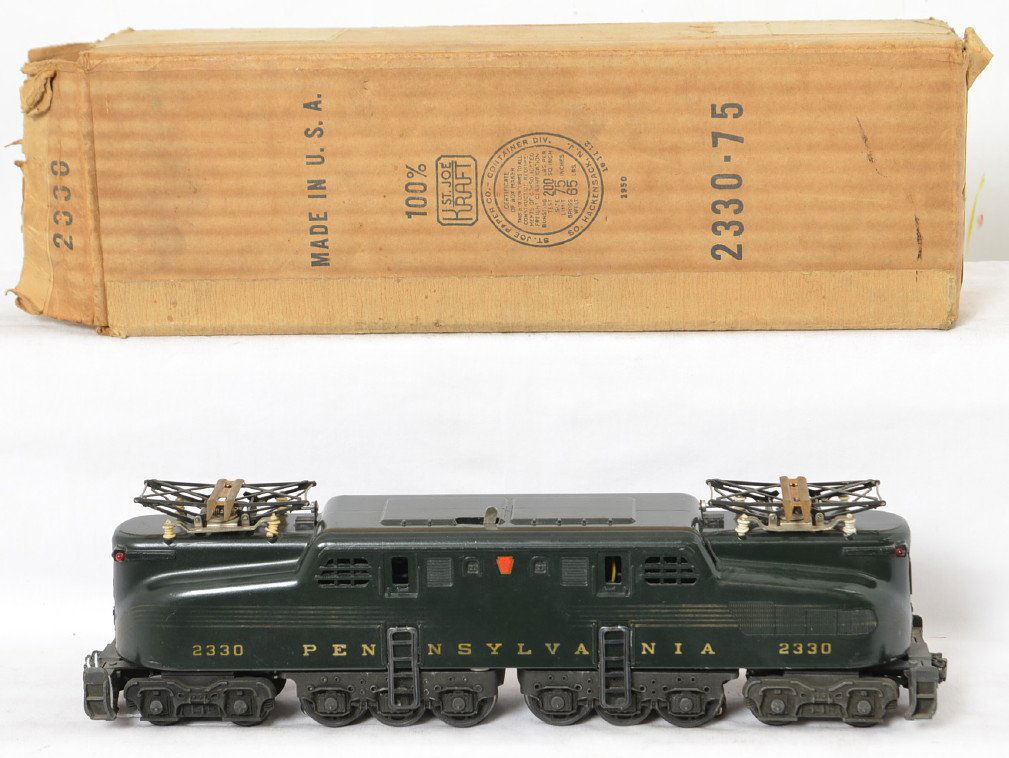 Lionel 2330 Pennsylvania GG-1 electric loco in OB: Postwar Lionel O gauge 2330 Pennsylvania GG-1 five stripe green electric locomotive in original box with insert. Train has weak stripes, very strong lettering, very shiny paint, C6. Box is very square