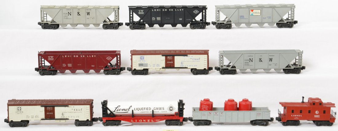 Lionel 6562, 6467, 6346, 6436, 6436-25, 6446 x2, more: Postwar Lionel O gauge 6562 New York Central canister car with three red canisters, 6467 Erie liquified gas car, 6346 Alco covered hopper, 6436 and 6436-25 LV hoppers, two 6446 N&W hoppers, two 6572 S