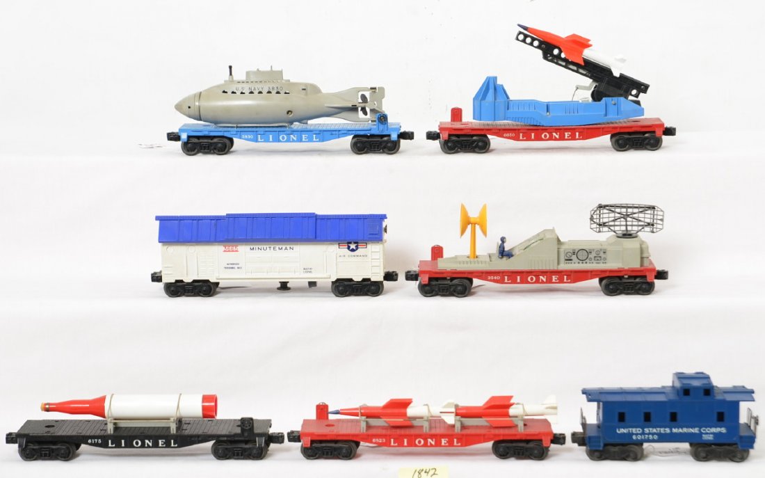 Lionel 3665 in OB, 3540, 3830, 6175, 6650, 6823,: Postwar Lionel O gauge 3665 Minuteman missile launching car in original box, 3540 operating radar, 3830 flat w/U.S. Navy sub, 6175 missile flat, 6650 missile launching flat, 6823 missile flat, and 601