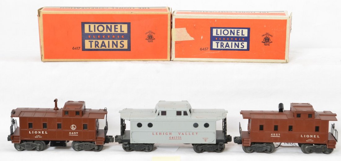 Lionel 6417-50, 6457, and 6557 w/two boxes: Postwar Lionel O gauge cabooses with two original boxes, C6. 6417-50 LV gray, 6457 caboose, and 6557 smoking caboose. 6457 OB missing flaps, tears, masking tape. 6417 has missing inner coupler protect