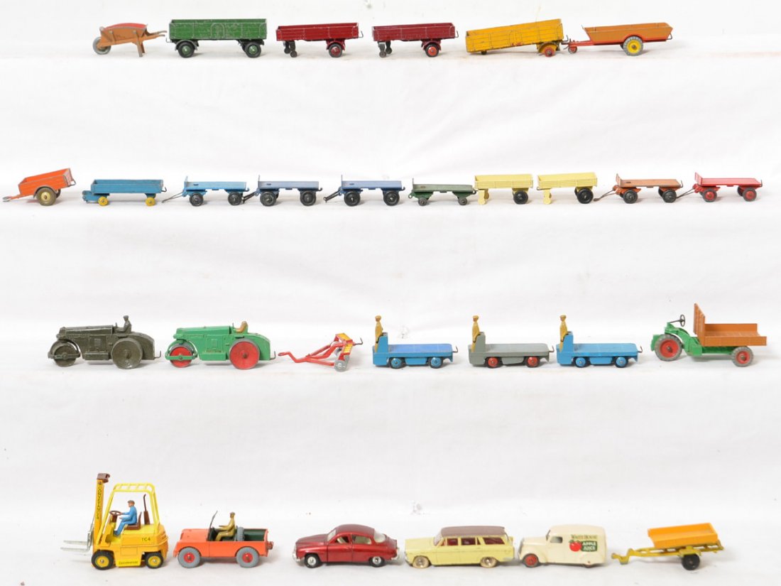 Huge group of Dinky Toys diecast trucks, cars,: Huge group of Dinky Toys diecast vehicles, cars, busses, semi tractor trailer, crane, fork lifts, steam rollers, 716 Westland-Sikorsky S.51 helicopter in OB, and more. Some trailers are missing wheels