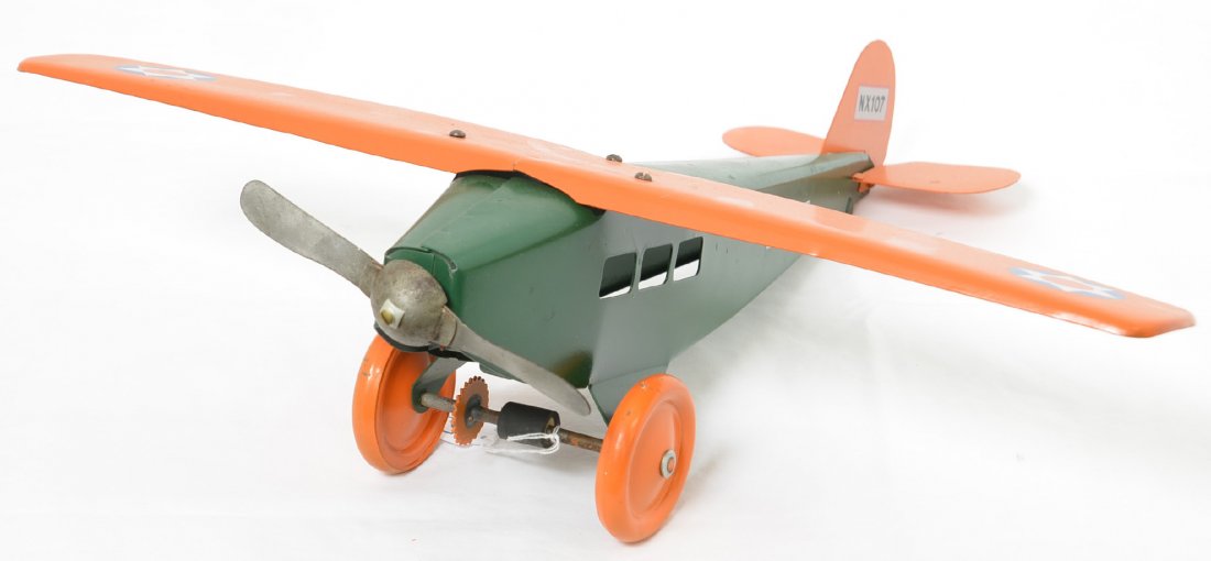 Steelcraft Army Scout Plane Repainted: This plane has been repainted and looks really nice with an original propeller but attached with newer hardware. There are a couple small dents in the wing but it displays very nicely and the decals l