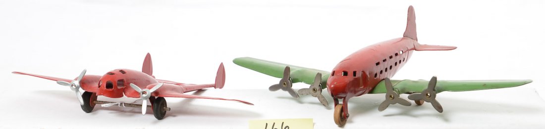 Two Wyandotte Pressed Steel Airplanes: Both planes are complete but the small red plane has been repainted. The larger plane has some paint wear but no rust and is very clean. Small plane is 6Ã“ long with an 8 1/2Ã“ wing span, larger