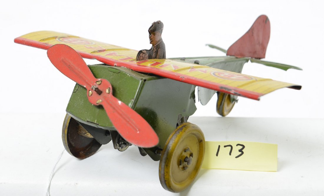 Strauss Tin Clockwork Mailplane: Nice all original tin wind-up with fantastic lithographed wing and pilot. Minor play wear, a few scratches and a couple minor bent edges but overall a really nice old toy. Plane is 8Ã“ long with a 