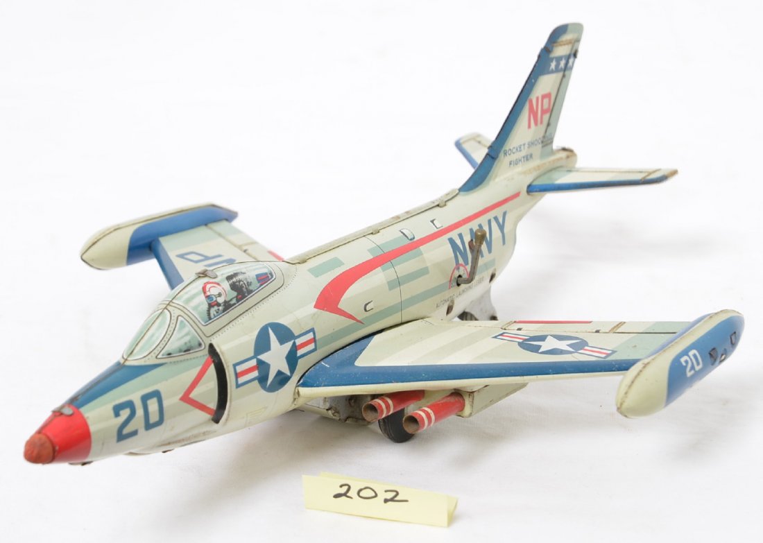 Tomiyama Yonezawa Tin Friction Navy Jet Large: Fantastic Rocket Shooting Fighter with very minor play wear and a few small rubs. Friction mechanism works nicely and toy displays very nicely.