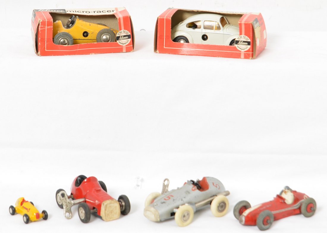 4 Schuco Micro Racers & Dinky Maserati: Group of two boxed Schuco Micro Racers and one loose one as well as a schuco Piccolo Mercedes 1936 replica and a Dinky Toys Maserati. All are in nice shape and three of the four wind ups work. One rac