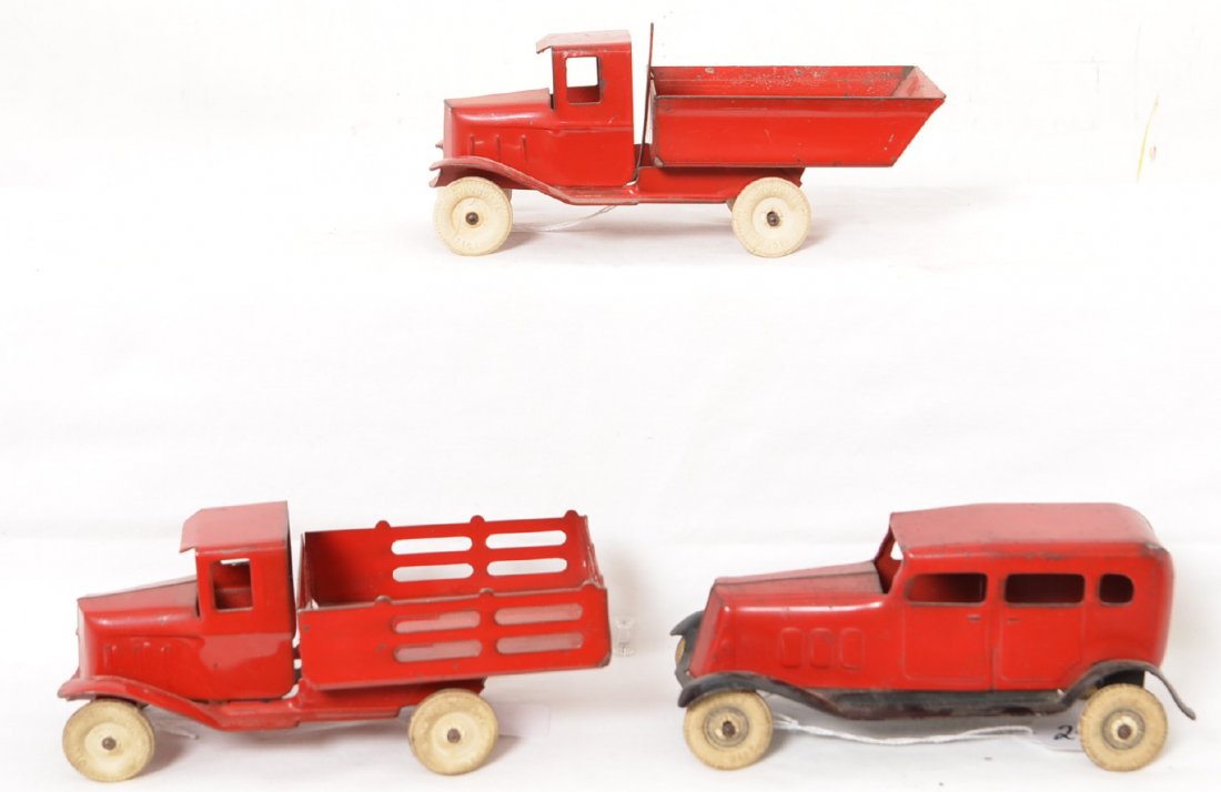 Wyandotte Trucks & Sedan 7Ã“: All three vehicles appear to be all original with minor paint wear and nice looking white rubber tires that do exhibit some wear and age cracking / deterioration. The two trucks are right around 7Ã��