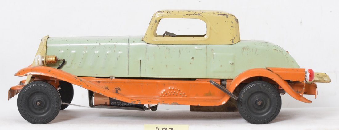 Girard Wind Up Car with Lights: Car has a number of small scratches and paint flakes but has nice eye appeal. The parts appear to be all original and it doesnÃ•t appear to be missing anything and the lights even work. The wind-up