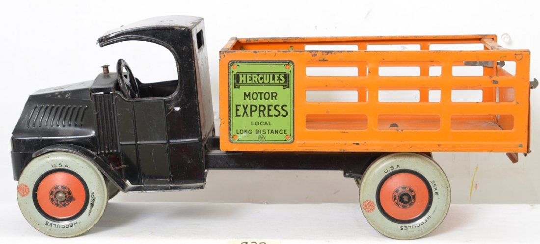 Chein Hercules Mack Stake Truck: Very nice looking tin truck with no missing parts and all original in every respect. There is some missing paint from play wear but the truck has great eye appeal. It even has a drop down gate in the 