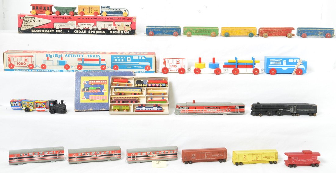 Four Wooden toy Trains 3 New in Box: Wooden toy trains including Toia, Blockraft and Childhood Interests all new in box. Miamicraft lines train also included and in nice shape but no original box. These trains vary in size and colors.
