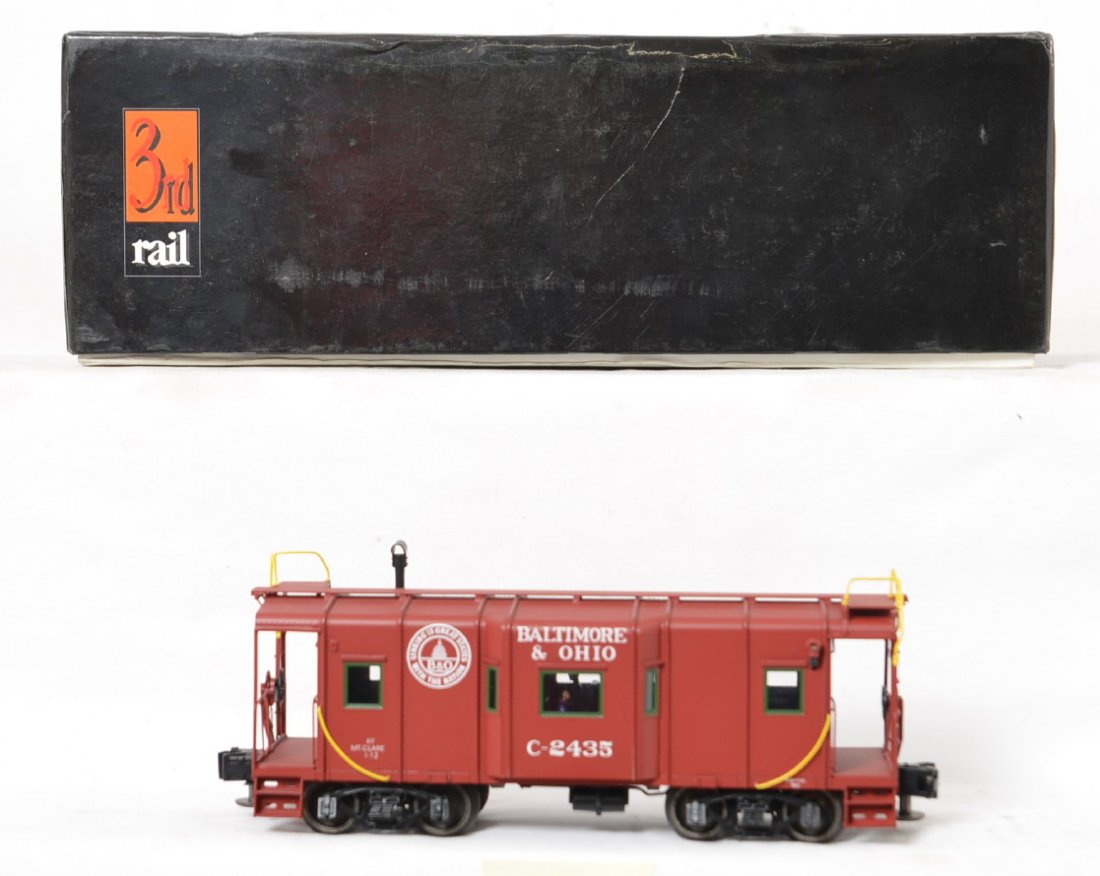 3rd Rail brass B&O wagon top caboose: 3rd Rail brass modern O gauge 2435 Baltimore and Ohio wagon top caboose in OB. Caboose is C8 with run time. OB has some light wear and dust.