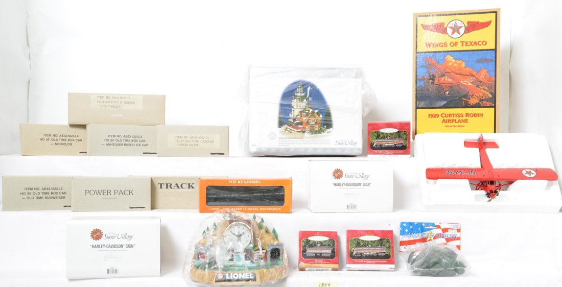 Dept. 56, Hallmark, Ertl, Lionel, more: Dept. 56 Snow Village, Hallmark ornaments, Ertl airplane bank, Lionel HO train in box, more. This is a General Condition lot, meaning we have not examined or graded every item in the lot so the condit