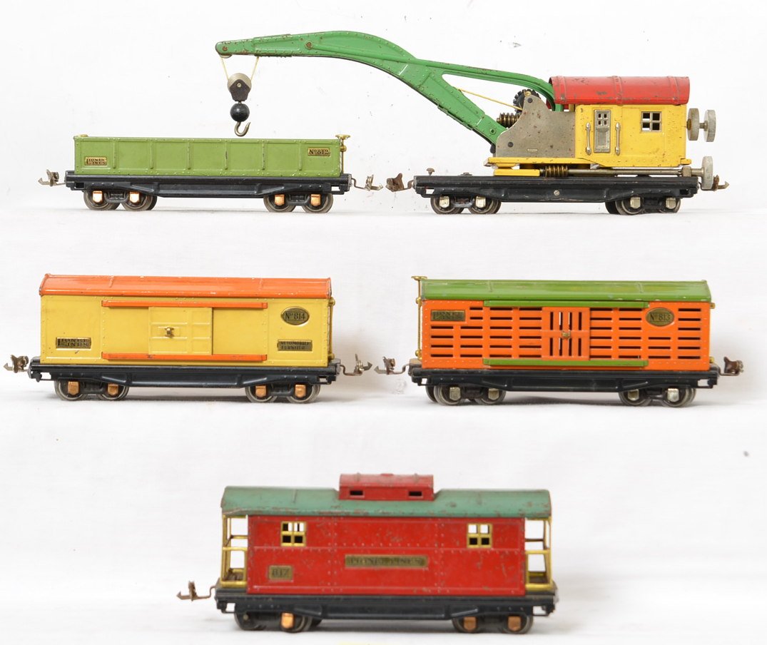 Lionel 810, 812, 813, 814, 817 freight trains: Prewar Lionel O gauge freight trains, 810 operating derrick, 812 gondola, 813 stock car (old touchups to roof), 814 boxcar (splotchy finish on roof), 817 caboose. Trains should clean to look C6.