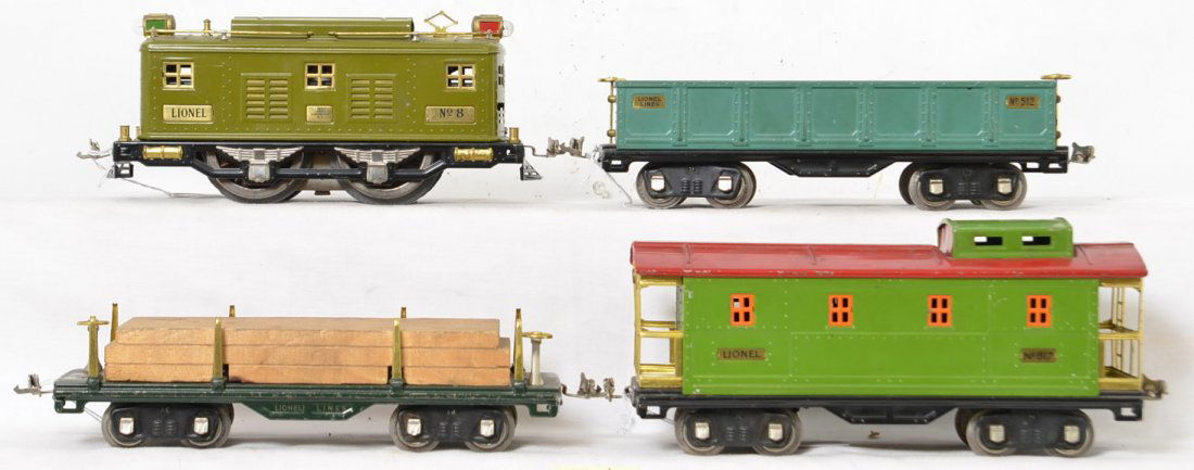 Lionel No. 8, 511, 512, 517 electric freight set: Prewar Lionel standard gauge No. 8 boxcab electric locomotive with 511 flatcar with lumber, 512 gondola, and 517 caboose. Cars have nickel journals. Trains look C6-7.
