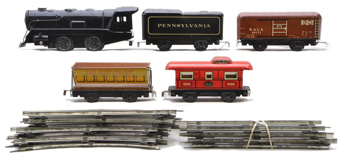 Marx Litho Freight Set 833 Tender 567 90171 556: Marx lithographed freight set including; 833 black clockwork steam loco, Pennsylvania tender, 567 yellow New York Central side dumping car, 90171 brown B. & L.E. boxcar, a 556 red New York Central cab
