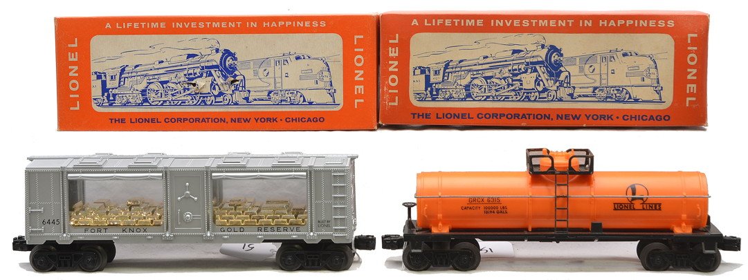 Lionel 6445 Fort Knox 6315-50 Chemical Tank: Lionel postwar 6445 Fort Knox gold bullion transport car and a 6315-50 orange chemical tank car both in OBs, C8. The 6445 OB has all flaps attached. The 6315-50 OB has tape repair.