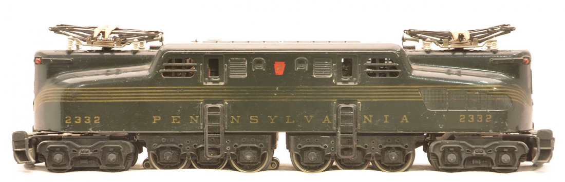 Lionel 2332 Dk. Gr. PRR GG1 Electric Loco: Lionel postwar 2332 dark green Pennsylvania GG1 electric loco with five gold stripes. The striping and lettering is faded. Loco is C6.