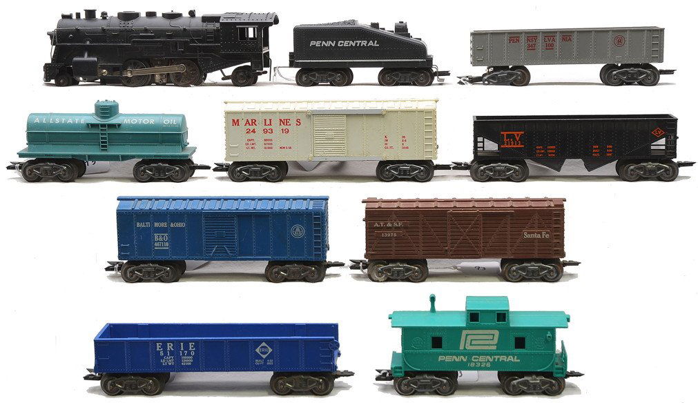Marx 1666 Loco PC Tender and Freight Cars: Marx 1666 steam loco with a Penn Central slope-back tender and freight cars including; 21913 Lehigh Valley hopper, 51170 Erie gondola missing one end, Allstate Motor Oil tank, 347100 Pennsylvania gond