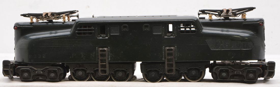 Lionel 2332 Dk. Gr. PRR GG1 w/5-Silver Stripes: Lionel postwar 2332 dark green rubber-stamped Pennsylvania GG1 electric loco with five silver stripes. The lettering and stripes on the loco are faded. GG1 is C6.