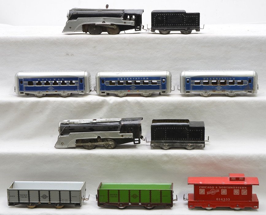 Hafner Streamlined Litho Pass Set & Freight Set: Hafner streamlined lithographed passenger set including; 1010 black clockwork steam loco with silver boiler front and side boards, four-wheel black tender, Pullman and two observations. The four-wheel
