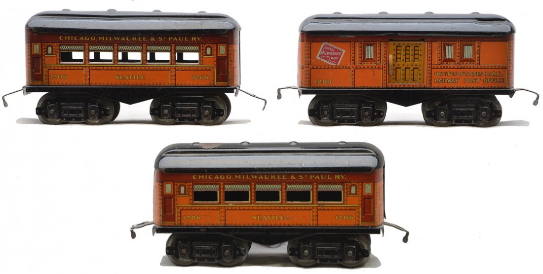 Am Flyer Orange Litho CM&St.P Cars 1205 2-1206: American Flyer O gauge orange lithographed eight-wheel Chicago, Milwaukee & St. Paul RY. passenger cars with black roofs including; 1205 baggage and two 1206 Pullman, C6.