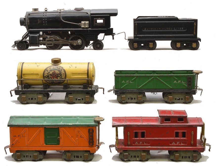 AF Freight Cars 3016 3015 3018 3017 403 421: American Flyer prewar O gauge eight-wheel freight cars with gray trucks and brass journals including; 3016 green sand car, 3015 orange boxcar with green roof, 3018 yellow A.F. Lines tank and a 3017 re