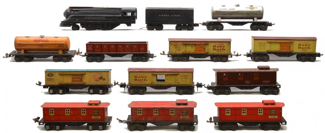 Lionel 1688 1689T 1677 3-1679 2-1680 3-1682: Lionel prewar O gauge 1688 black steam loco, 1689T tender with one postwar truck and lithographed freight cars; 1677 gondola, three 1679 Baby Ruth boxcars, 1680 silver Sunoco tank, 1680 orange Shell t