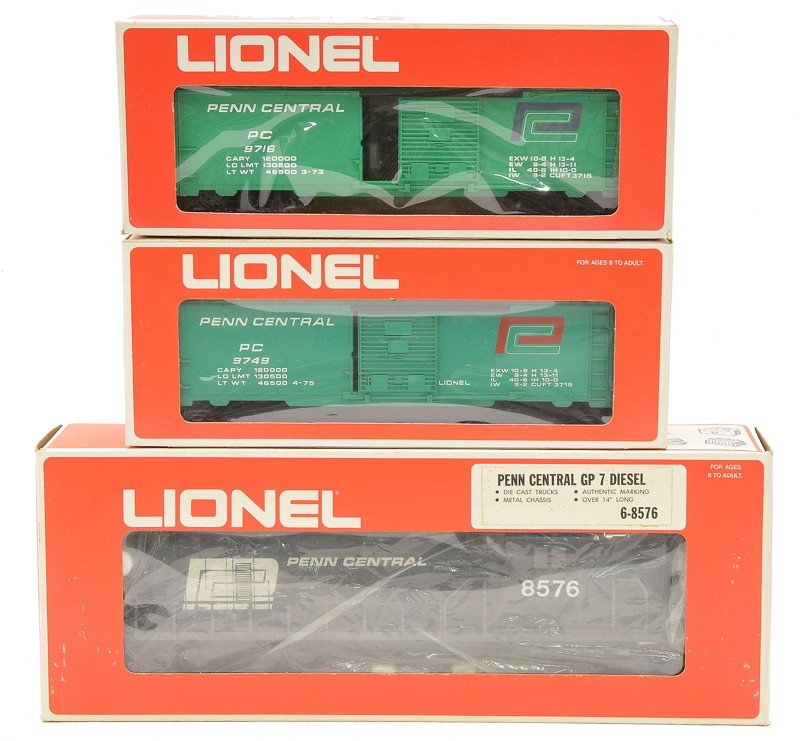 Lionel Penn Central 8576 GP7 9716 9749 OBs: Lionel Penn Central 8576 G97 diesel and freight cars; 9716 boxcar and a 9749 boxcar all in OBs, C8.