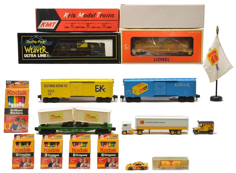 Kodak Lionel 16188 9120 & Misc. Kodak Items: Kodak Lionel 16188 single dome tank car and a 9120 NP flatcar with two Kodak trailers, two KMT Kodak boxcars and Weaver 1127 Kodak tank. Also included is a Winross Kodak tractor and trailer, Lledo vin