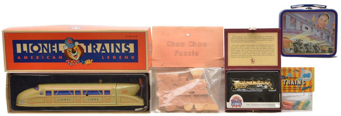 Lionel Tin Train by Schylling Hallmark Keepsake: Lionel wind up tin train floor toy by Schylling in OB, Hallmark Keepsake Ornament Lionel 100th Anniversary 700E in OB, a wooden choo-choo puzzle, Lionel Trains tin and a package of Fun Capsules trains