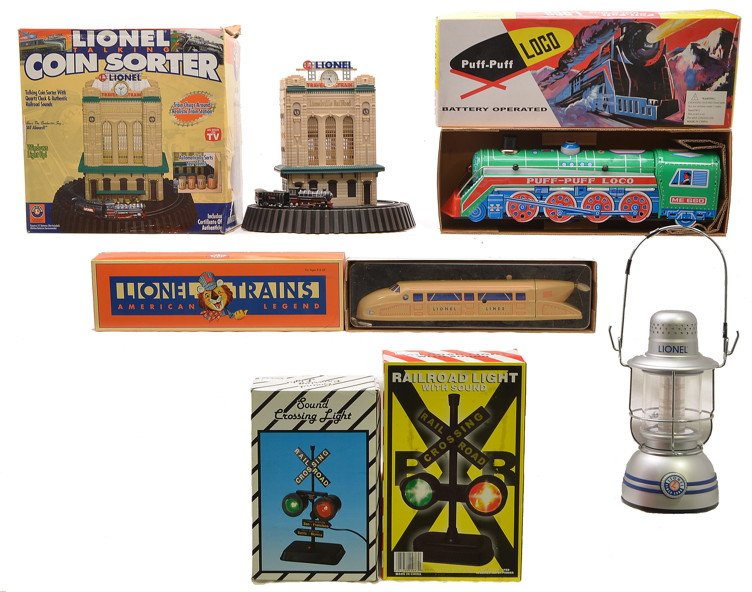Lionel Coin Sorter Lantern Wind Up Train Signals: Selection of accessories; Lionel talking coin sorter, lantern and wind up tin train by Schylling, Puff-Puff ME660 battery operated loco, sound crossing light and a railroad light with sound all in OBs