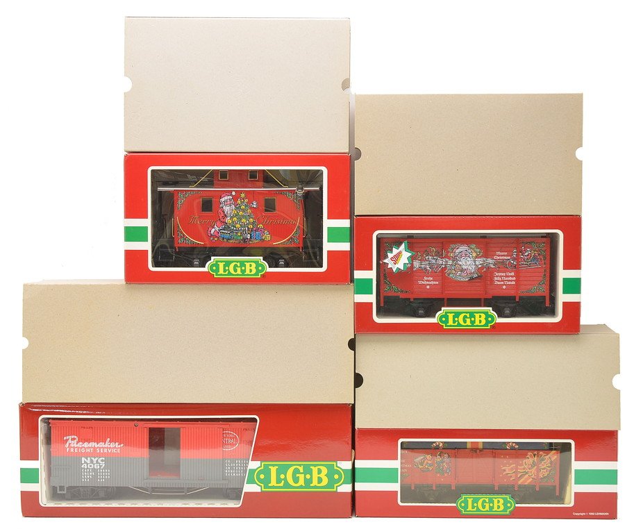LGB 4335S 4021CT 44650 4067-F01 OBs: LGB G gauge 4335S Christmas boxcar, 4021CT Christmas gondola and a 44650 Christmas caboose all in OBs with outer sleeves. Also included is a LGB G gauge 4067-F01 Pacemaker boxcar in OB with outer slee