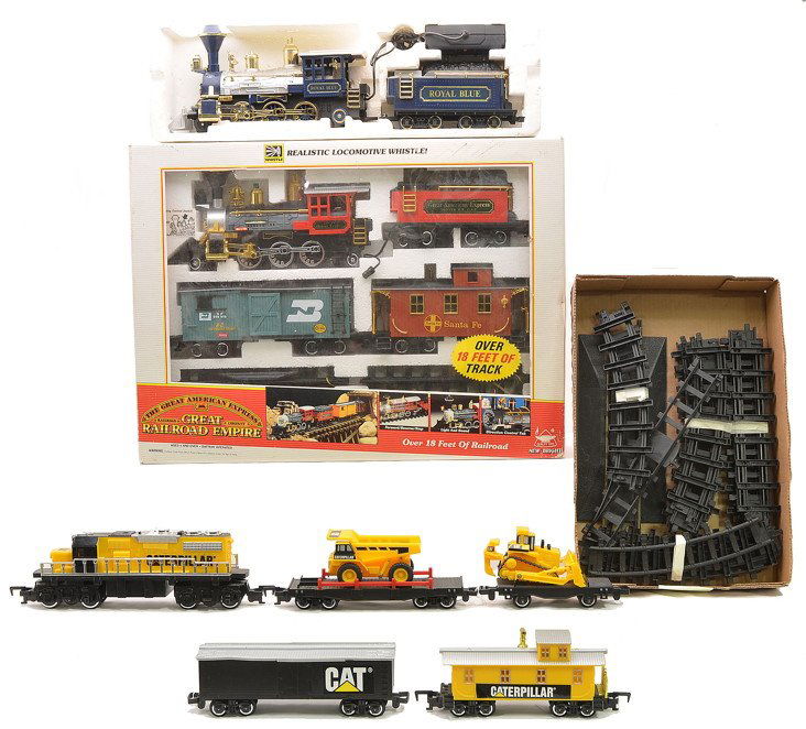 New Bright no. 185 RR Set TSI Caterpillar Set: New Bright G gauge no. 185 Great American Express Railroad Empire train set in OB and Royal Blue steam loco and tender. Also included is a Toy State Industrial G gauge Caterpillar freight set with tra