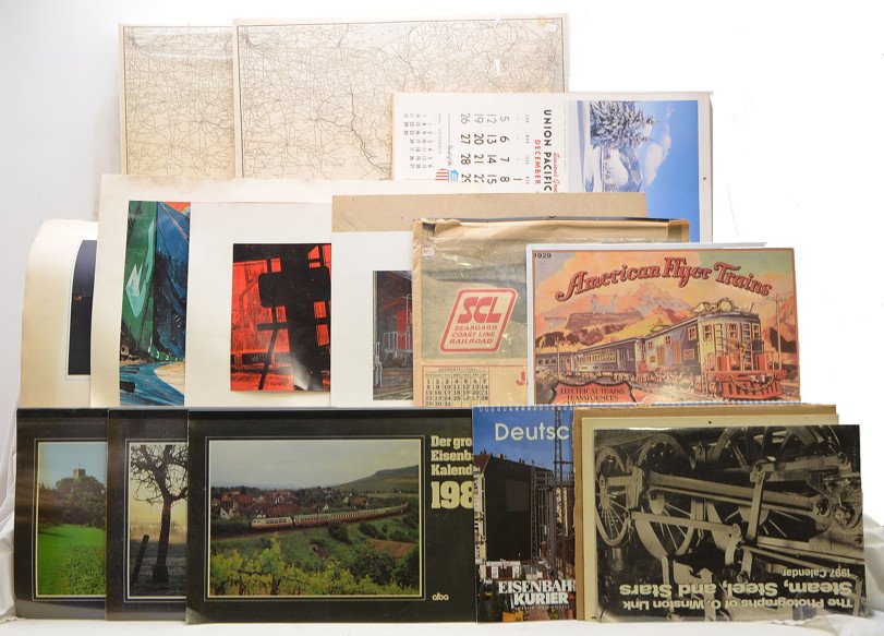 Selection of Calendars Prints and Maps: Selection of German railroad calendars. Union Pacific calendars from the 1960s and 1970s, color prints, NYC prints from Iron Horse Productions, railroad maps, 1929 American Flyer Trains metal plaque. 