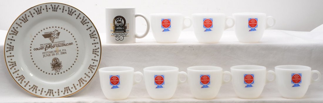 Selection of TCA Glassware Coffee Cups & Mug: Selection of railroad glassware including; eight 10 Annual T.C.A. Convention Chicago, 1964 coffee cups, a TCA 1954-2004 coffee mug and a TCA 50 Anniversary Pittsburgh, PA dinner plate. Glassware is in