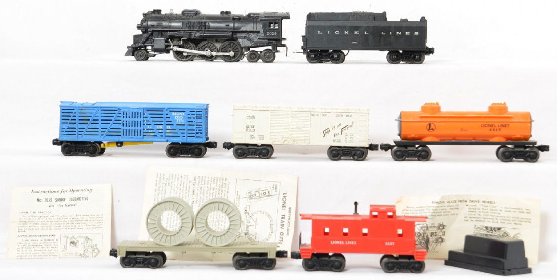Lionel Postwar 2029 Locomotive & Freight Cras: Includes 2029 steam locomotive with 234W tender, 6465 orange tank car, 3376 Bronx zoo car, 6014 white Frisco box car, 6401 flat car with gray reel load and 6257 caboose. Also included is a 147 control