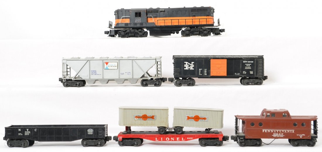 Lionel 2338 Milwaukee Road GP & Freight Cars: Includes a 2338 with some paint loss, nice clean frame and no broken or missing pieces. Also included are 6430 piggyback flat car, 6346 Alcoa hopper, 6464-425 New haven box car, 6462 black gondola wit