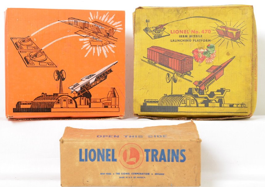Lionel Postwar 460 443 & 470 Accessories in OBs: Includes a nice 460 piggyback transportation set with original instruction sheet, 443 missile platform with exploding ammunition dump in a nice clean box with minor wear but staining or rub marks on t