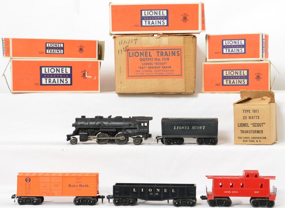 Lionel 1119 Scout Set in Box: Set includes 1110 steam locomotive with missing marker light and dinged boiler front, 1001T tender, 1002 gondola, 1004 box car and 1007 caboose all in original boxes. the cars all have some play wear 