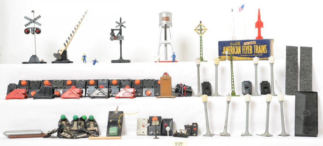 Large Group of Lionel & American Flyer Acc & Parts: Includes lots of different parts and accessories, bumpers, boulevard lamps a crossing gate, prewar water tower and crossing, postwar banjo signal # 364c 90 and 145c switches and contactors as well as 