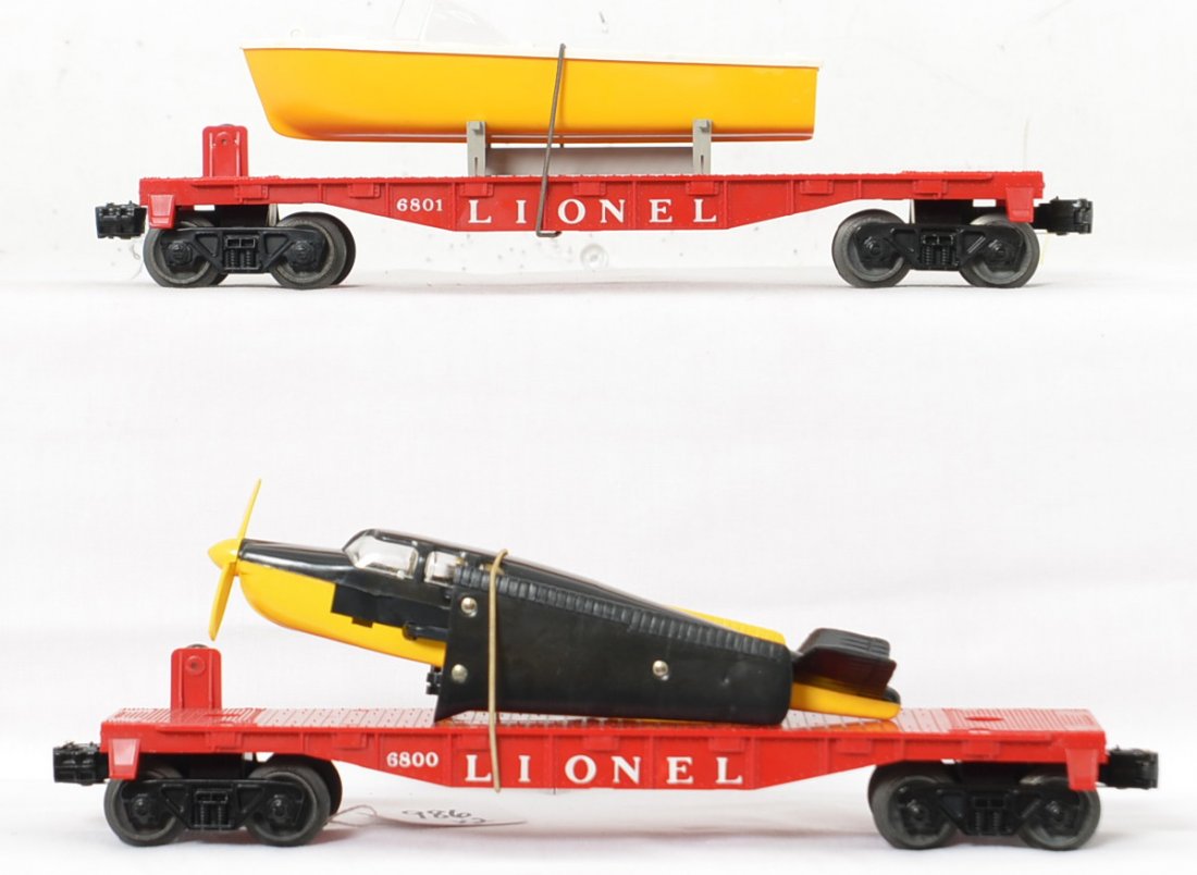 Lionel Postwar 6800 6801 boat & airplane flat cars: Both cars are in great shape with original loads and restraints. The beech craft bonanza is virtually untouched and its flat car is very nice with minimal handling and perfect lettering. the 6801 boat