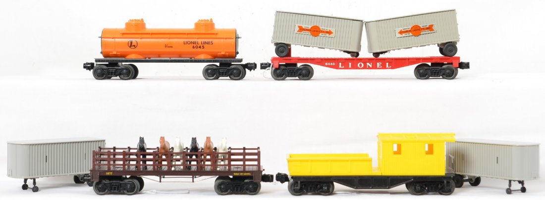 Lionel 6120 1877 6045 6440 rolling stock NICE: All four cars are in great shape and have very little run time on any of them. 6440 piggyback flat has two sets of loads, you pick what you want, the Cooper-Jarrett vans or the plain gray ones, the un