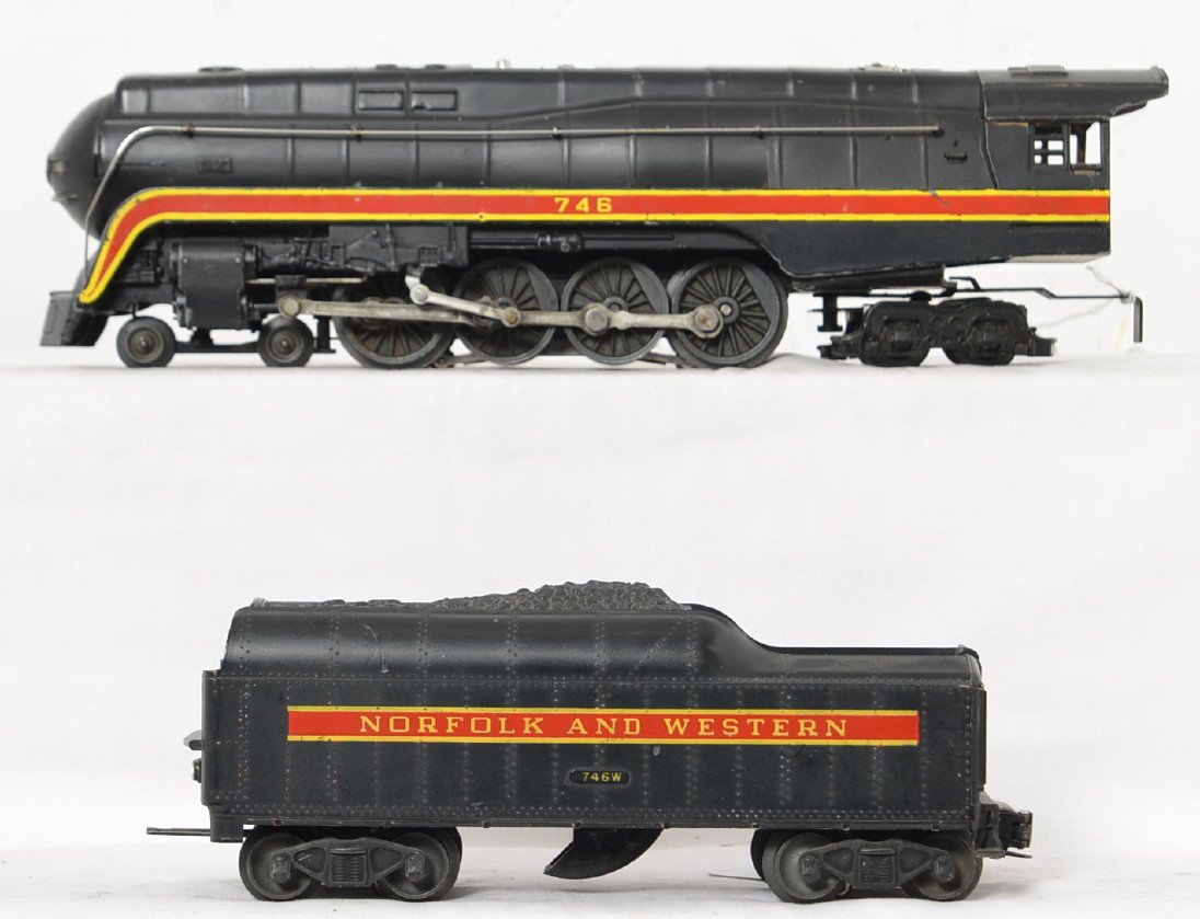 Lionel Norfolk and Western 746 J w/ short stripe tender: Locomotive has minor scratches and paint wear on the stripes and elsewhere as well as a ding on the cab roof but is still in nice shape. The tender is in nice shape with the marked and raised number o