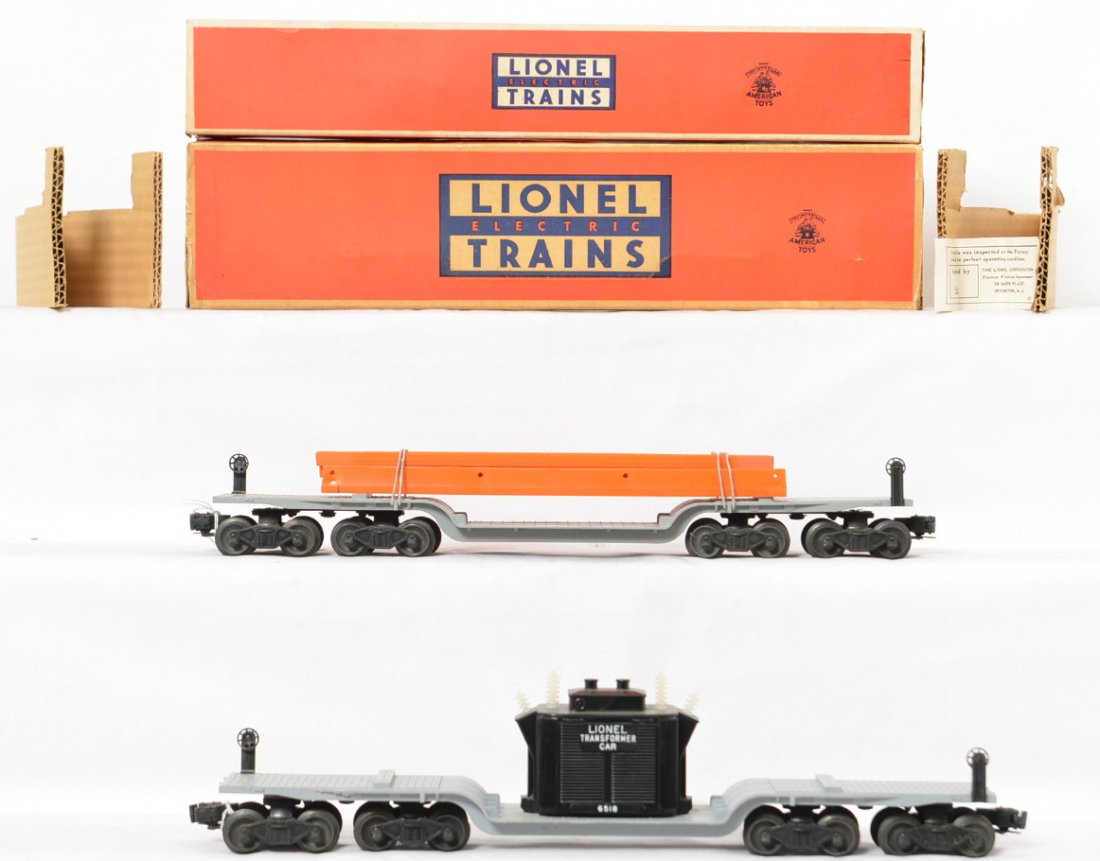 Lionel 6418 6518 depressed center flat cars in OBs: Both cars are in fantastic condition and extremely clean with perfect original loads. Both cars do show a small amount of run time but few signs of handling. The boxes are both complete but the 6418 h