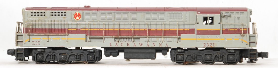 Lionel 2321 Lackawanna FM maroon roof: This locomotive has moderate run time but a fairly decent shell with nice lettering but in need of a thorough cleaning. It does have screw cracks on both ends and the walkways and handrails have rust 