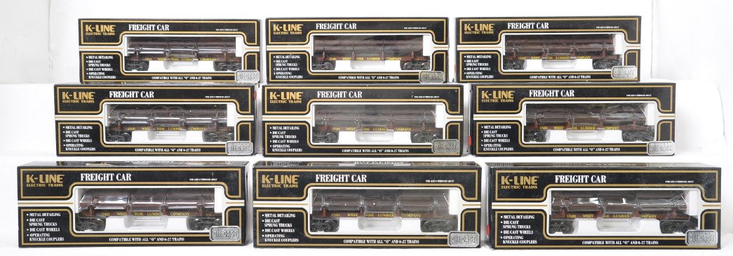 9 K Line Westside Lumber die cast skeleton log cars: K Line modern O gauge die cast Westside Lumber skeleton log cars in OBs. Nine cars include four K663-8015 and five K663-8014 . Cars are generally C8. OBs have light corner wear.