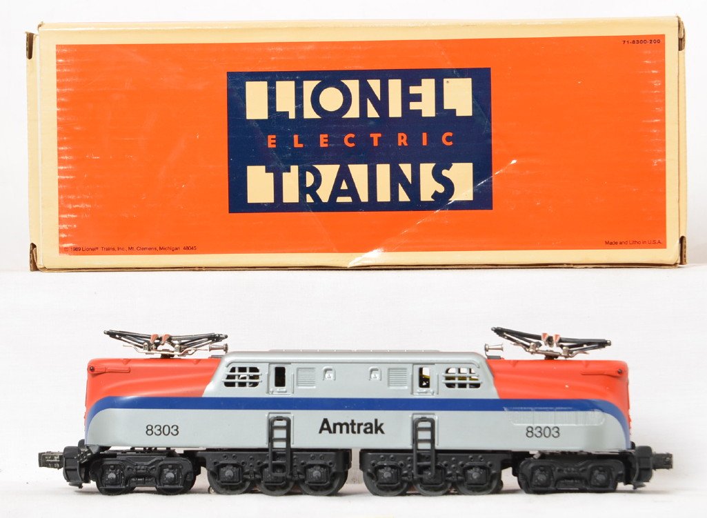 Lionel 18303 Amtrak GG-1 locomotive: Lionel modern O gauge 18303 Amtrak GG-1 locomotive in OB. Features dual motors, Magne Traction and more. Loco body is C8, but frame is C7 with some heavier run time, some wear to pickup rollers. OB ha