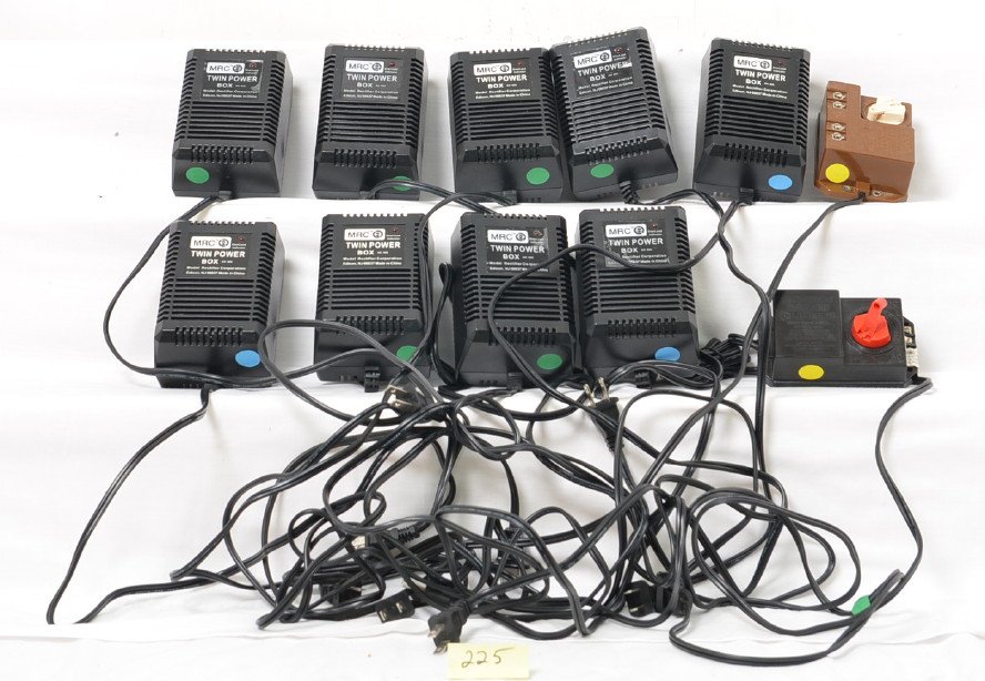 9 MRC accessory power packs: MRC modern power packs. These packs put out 12V and 18V. Great for lighting buildings and other fixed voltage accessories. Packs are layout used C8, nine total plus two small HO transformers.
