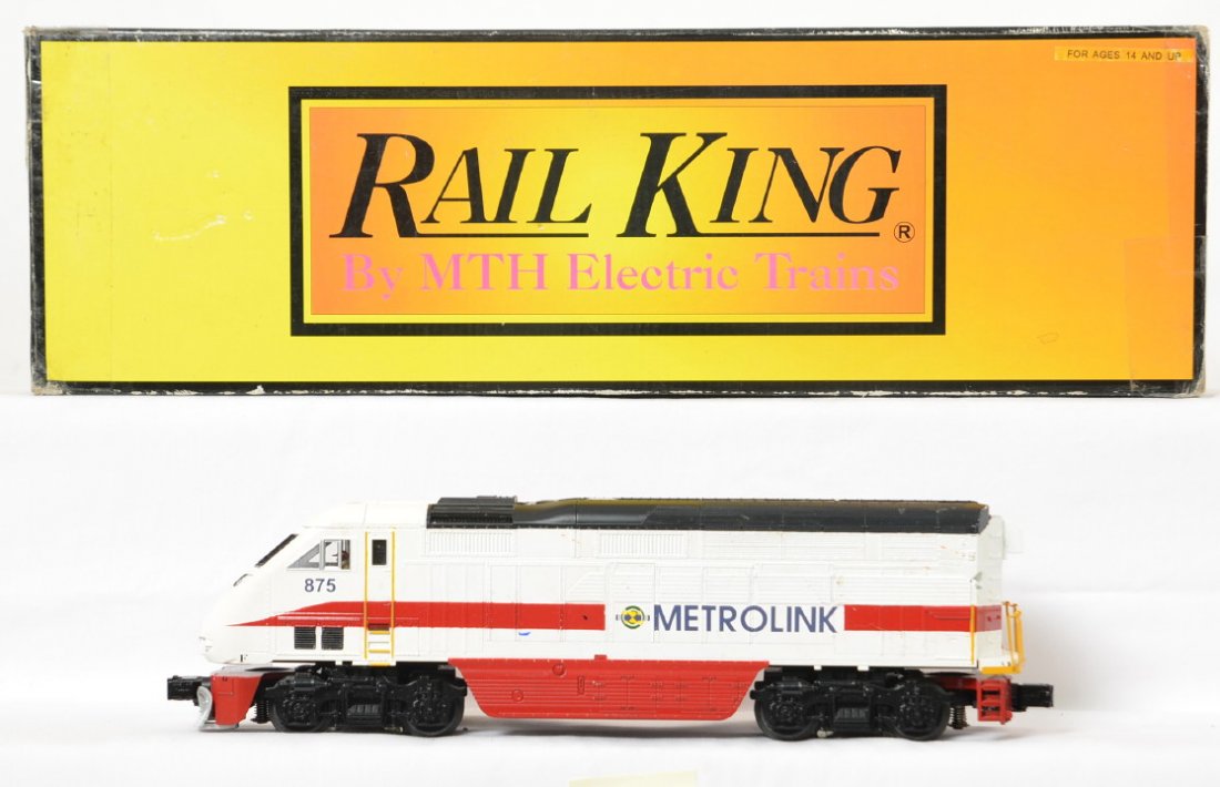 Railking Metrolink F59PHI with Proto 2: MTH Railking modern O gauge 30-2864-1 Metrolink F59PHI diesel locomotive in OB. Loco features Protosound 2.0, DCS control, Protosmoke, Protocouplers, and more. Loco is C6-7 with notable scratching and